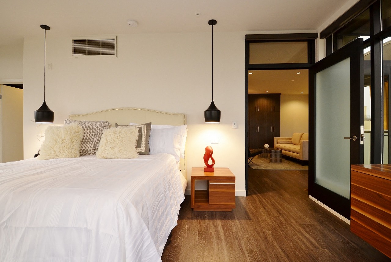 a view of the living room and dining area in a one bedroom suite at the loews